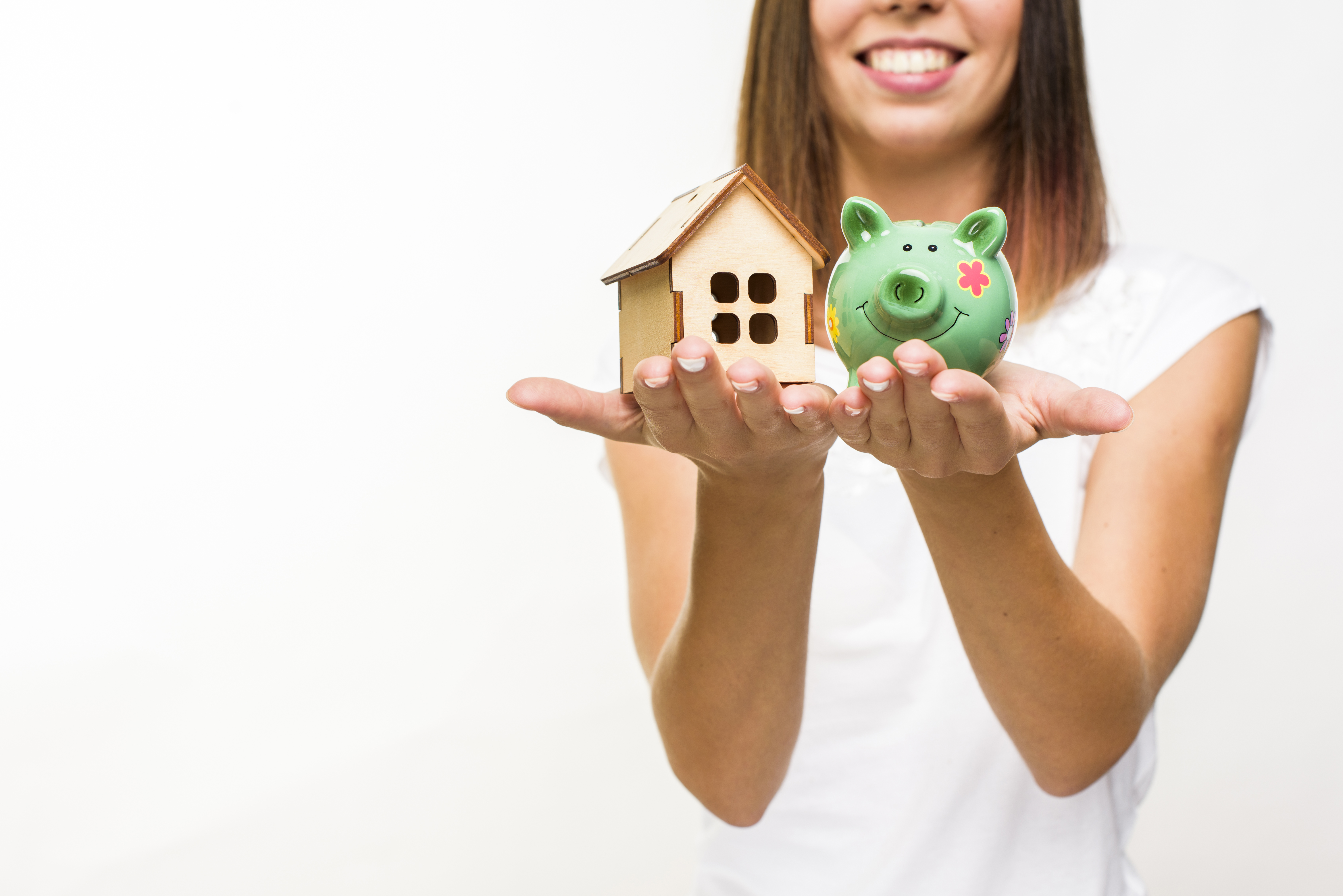 Happy woman with piggy bank